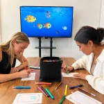 woman drawing fishes