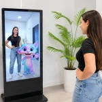 girl standing in front of AR photobooth