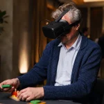old man playing interestin avatar game with soeacial glasses
