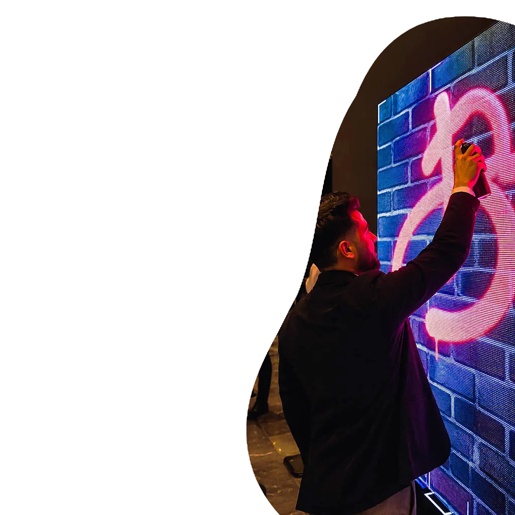 men drawing on a digital graffiti wall