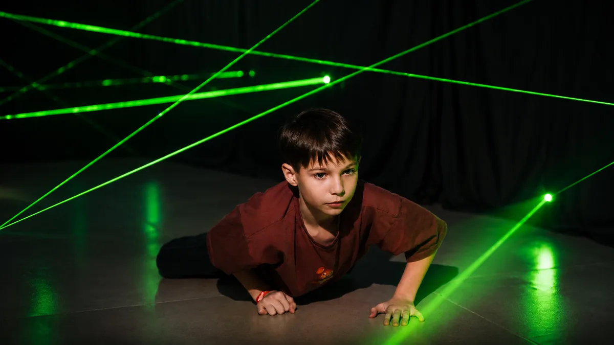 child in a laser maze