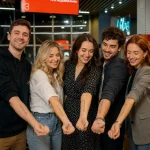 group photo of people with tattoo station