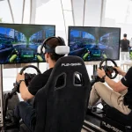 mens playing vr game in racing simulators