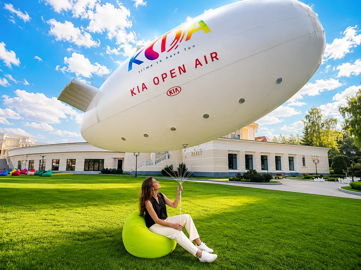 girl holding advertising airship