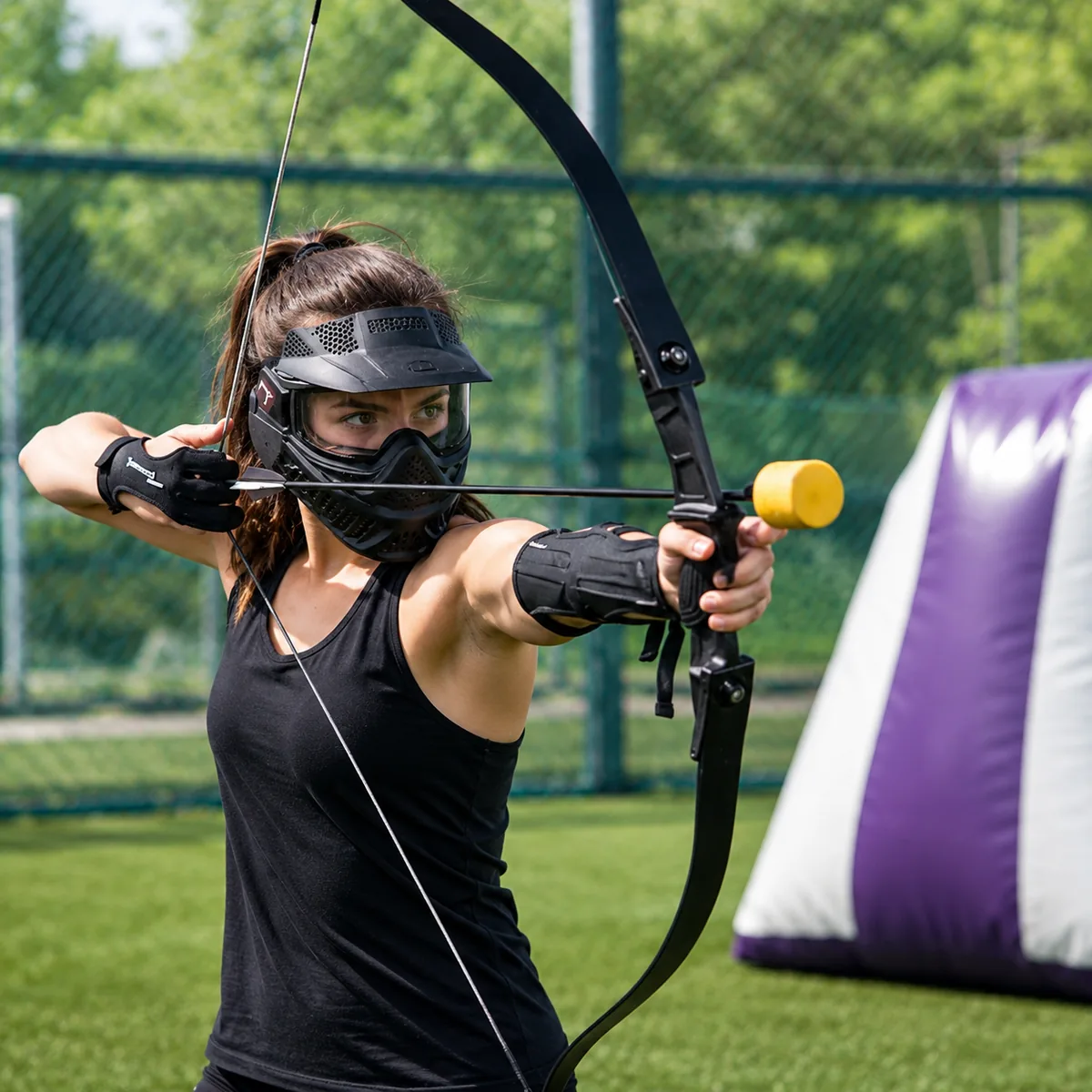 girl playing archery tag game