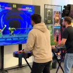 guys playing with giant sega controllers
